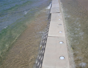 Sandsaver, Sand saver, beach erosion barrier, installed sandsavers, sandgrabber barrier, beach renourishment