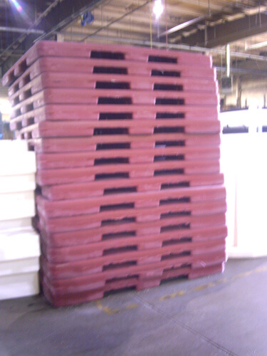 Stack of Plastic Pallets, Plastic Pallets being manufactured