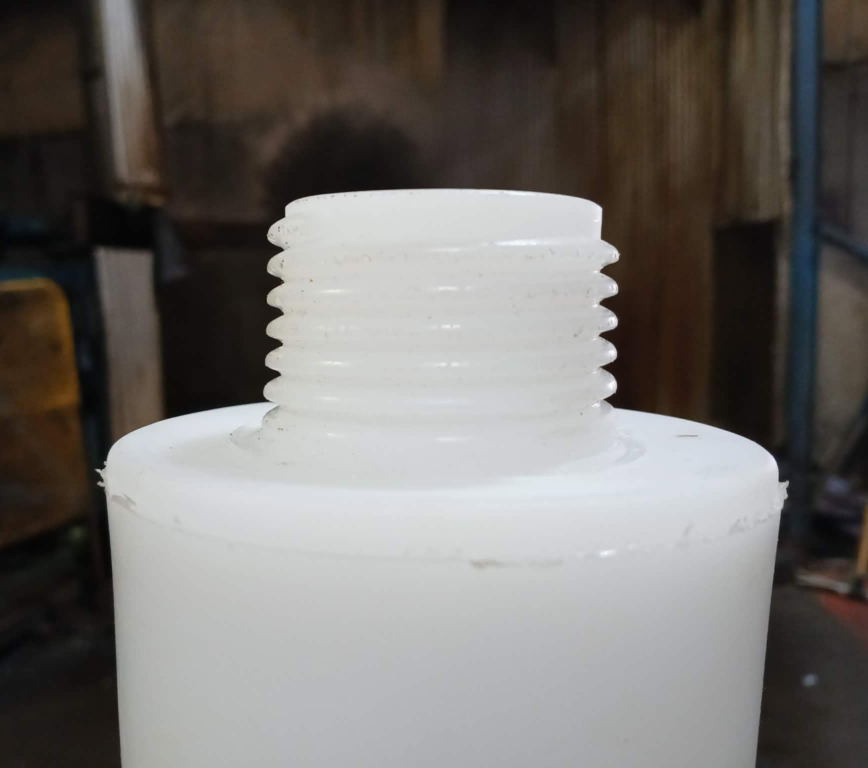 rotationally molded polyethylene part with molded external threads