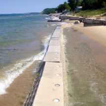 Waves crashing against Sandsaver modules installed in Lake Michigan